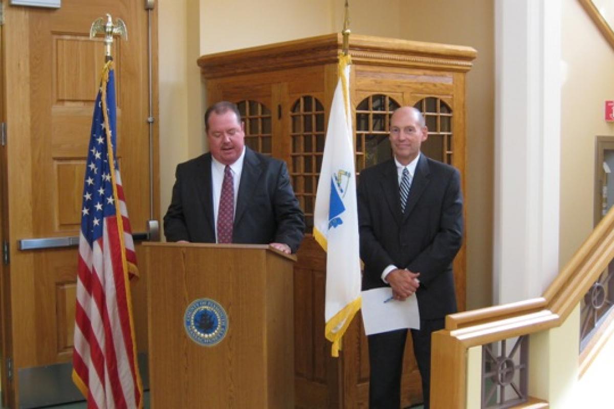 Building Committee Chairman Joseph S. MacInnis at podium, Plymouth County Commissioner Anthony T. O'Brien at left.